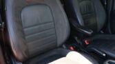 Front black leather car seats with red RS embroidery and red contrast stitching.