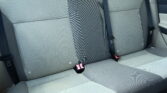 Rear car seat with three-point seat belts and gray upholstery