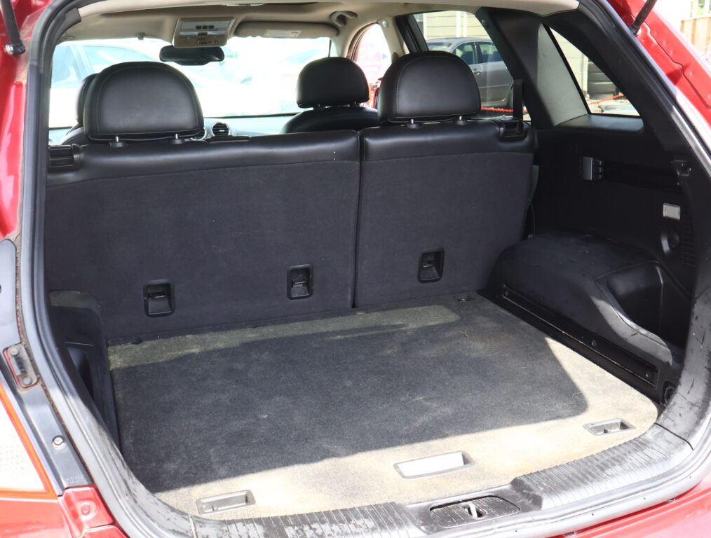 Open SUV cargo area showing the rear seats in place and black interior upholstery