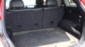 Open SUV cargo area showing the rear seats in place and black interior upholstery