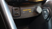Close-up of car dashboard showing the "PASSENGER AIR BAG OFF" indicator, USB ports, and surrounding console trim.