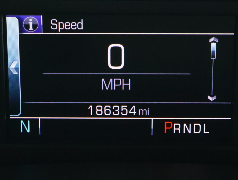 Vehicle dashboard showing current speed 0 mph, gear in Park, and 186,354 miles on the odometer