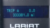 Digital instrument display showing Trip A reading 0.0 with teal dot-matrix digits