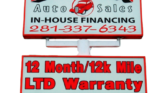 Two stacked signs for Dillon Auto Sales advertising in-house financing and a 12-month/12k-mile LTD warranty; includes website URL dillonaautosales.com (text-heavy sign)