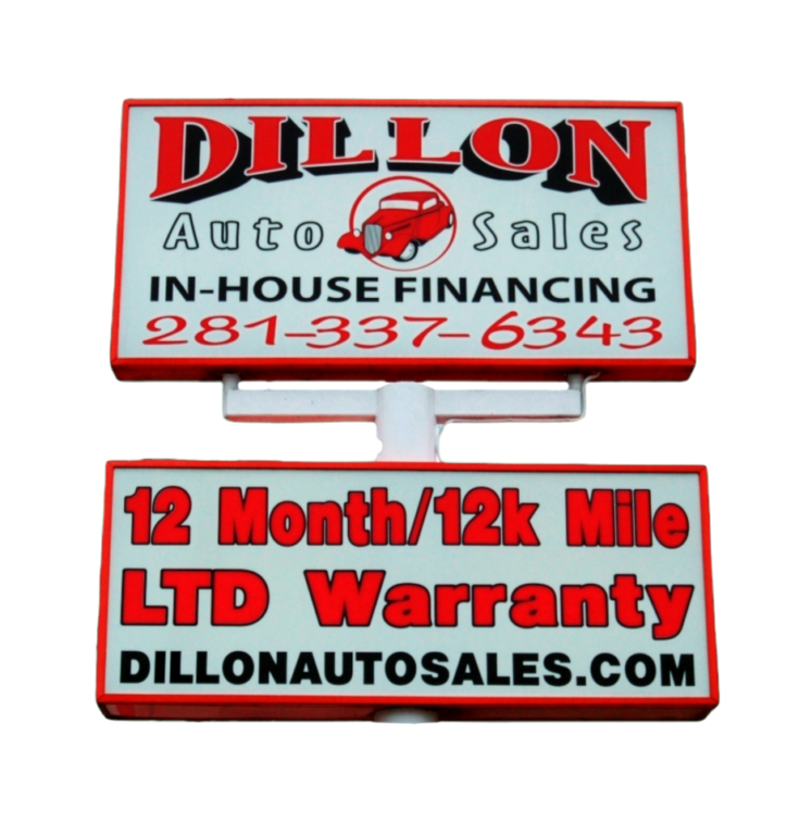 Two-part car dealership sign reading 'DILLON Auto Sales' with 'IN-HOUSE FINANCING' and a phone number; below, '12 Month/12k Mile LTD Warranty' and the site 'DILLONAUTOSALES.COM'