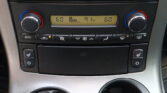Center console climate control with dual temperature dials set to 60°, and a digital display showing 91°F in the middle.